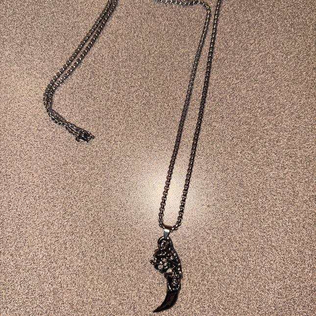 Silver necklace with dagger and dragon face